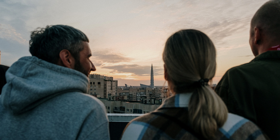 Three-people-on-a-rooftop