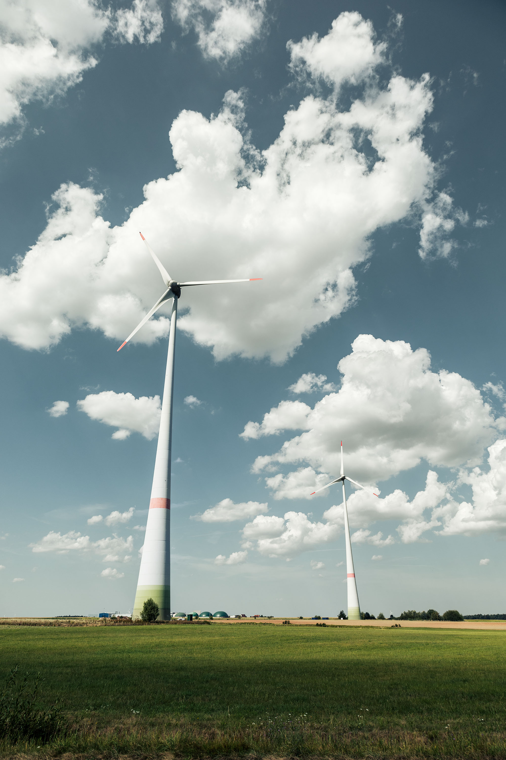Windmills on a field in the German countryside.