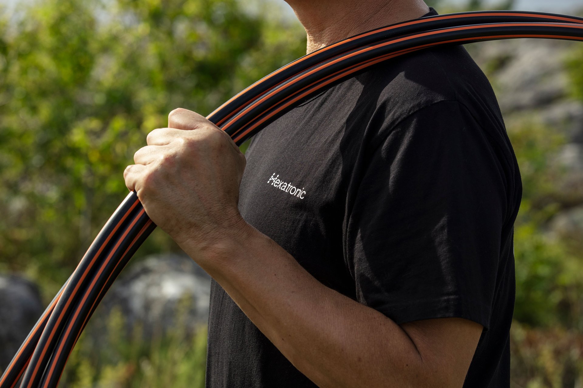 a person holding black and red striped ducts