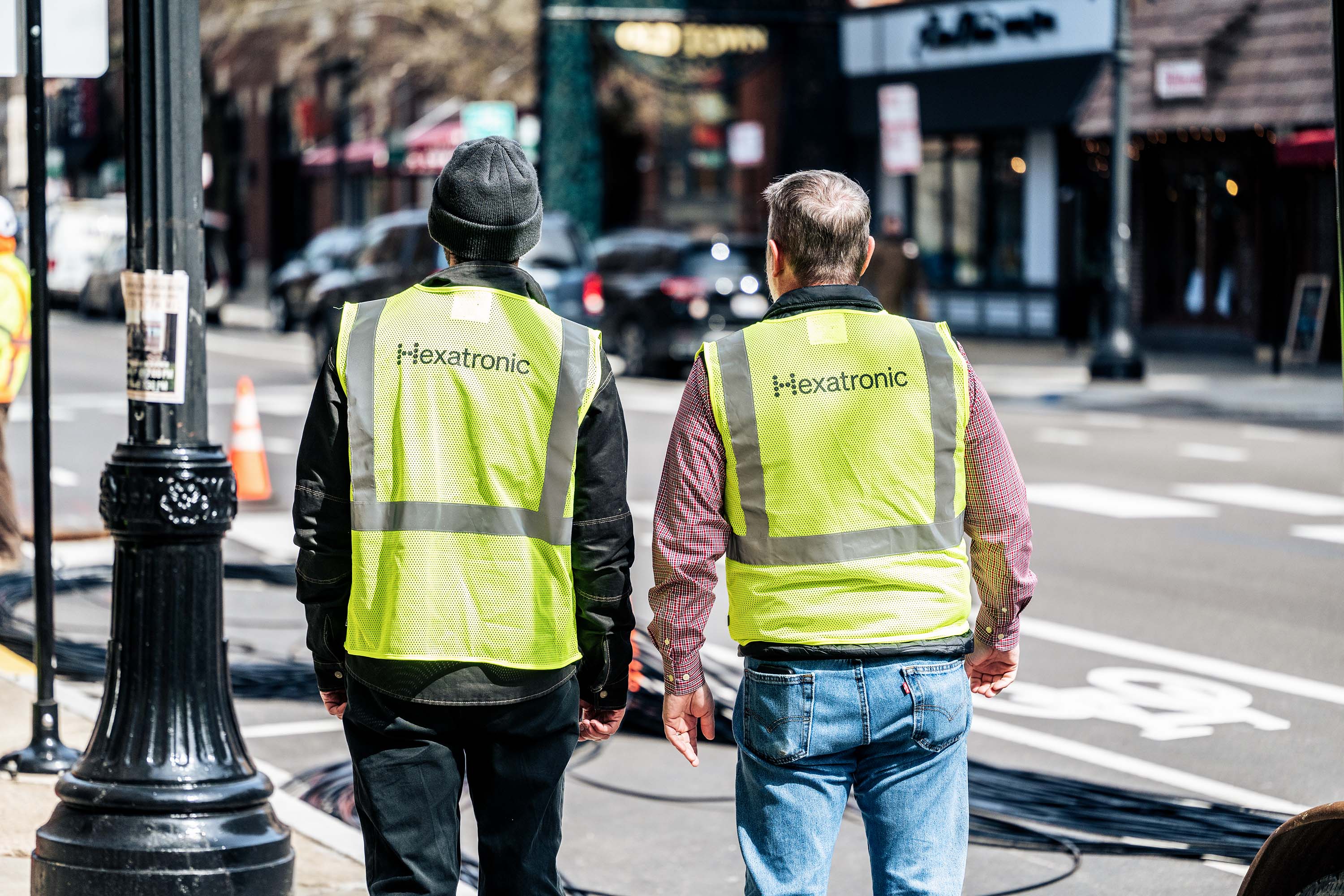 Two people in yellow vests with 