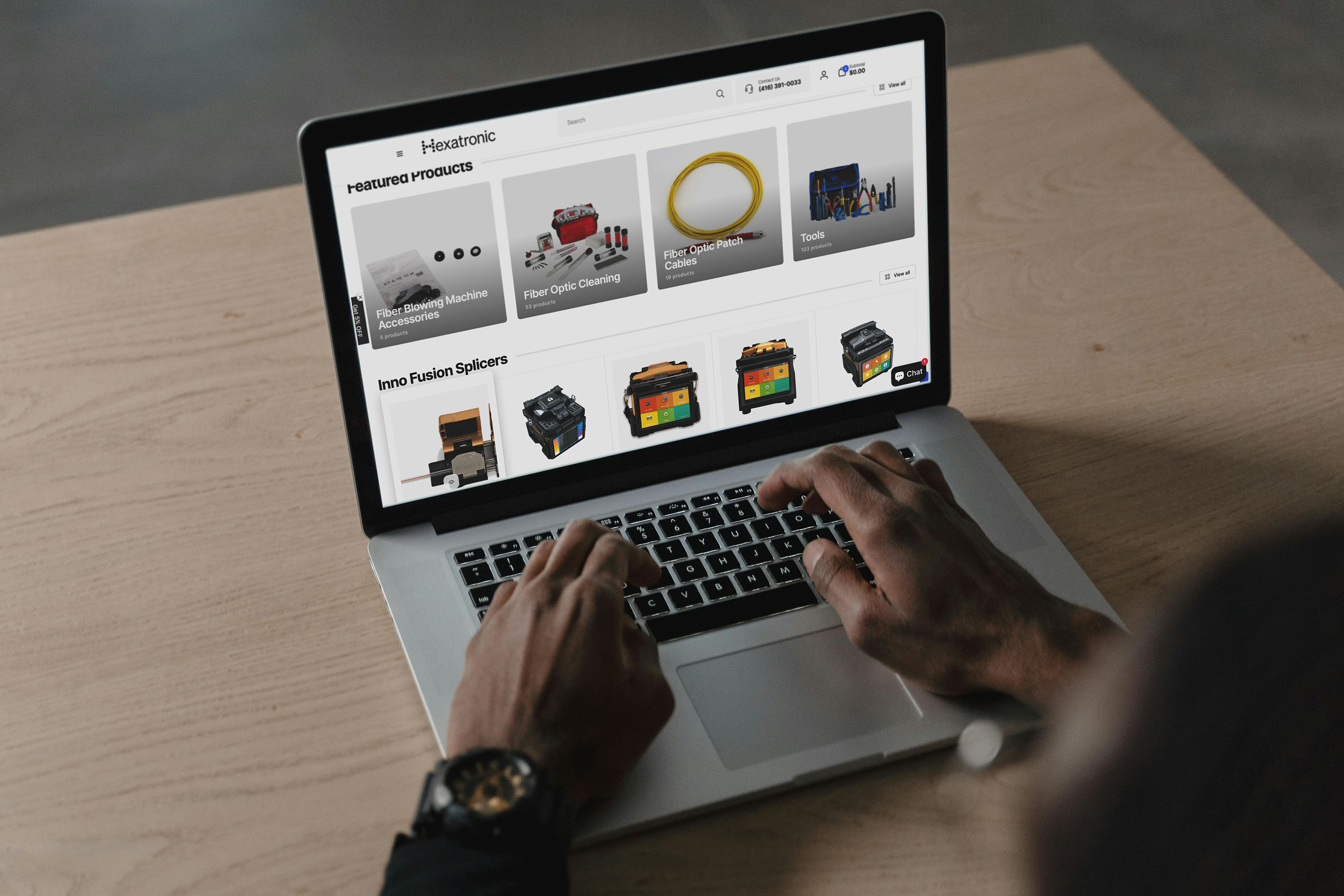 Person browsing Hexatronic Canada's webshop on a laptop